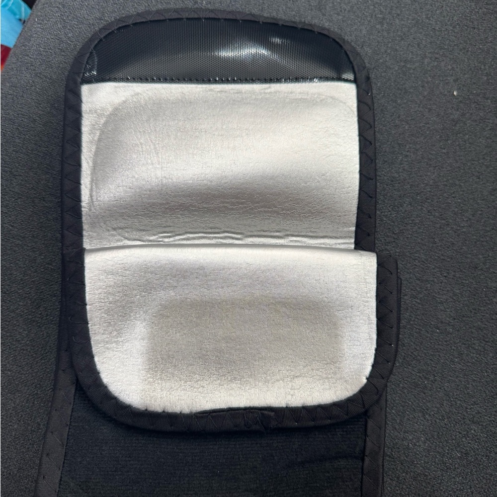 New in bag. Pair of black arm bands that heat to encourage sweat.